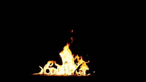 Huge line of flames swelling up by wind. Real Fire shot in 50 fps and isolated  Stock Footage 142064696