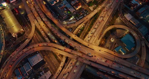 Huge lively interchange with hectic traffic. Top view on the busy intersection 스톡 동영상 327809843