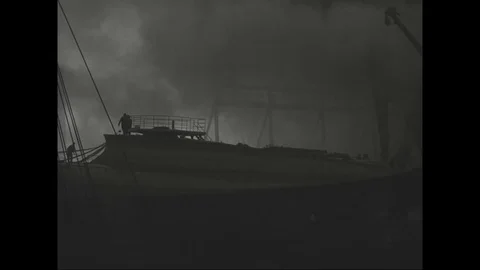 Huge loads of smoke billows from burning SS Normandie at Pier 88 - 1942 Stock Footage 101729091