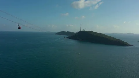 Huge long cable car over several islands connected in the ocean aerial above se Stock Footage 124366524