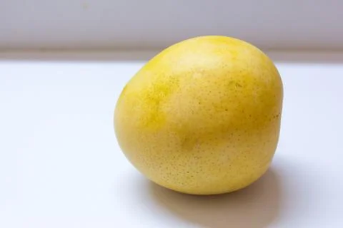 A huge mango on white background Stock Photos