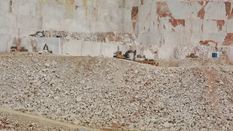 Huge Marble Mining Pit and Vehicles Stock Footage 71965772