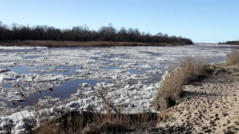 Huge masses of pack ice going down the river Gauja Stock Footage 149819115