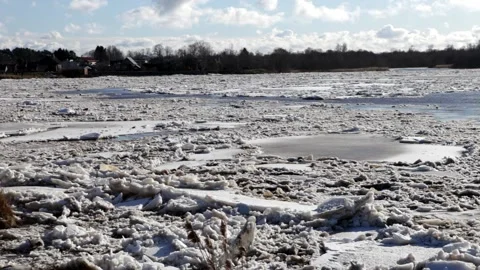 Huge masses of pack ice going down the river Gauja Stock Footage 149819128