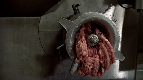 Huge meat grinder mincer machine produces minced meat. Industrial sausages Video stock 120694686