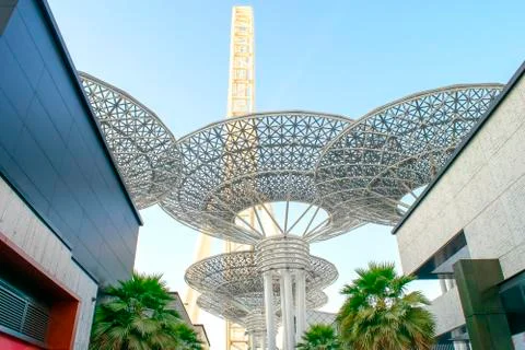 Huge metallic structures and ferris wheel in Bluwaters island. Stock Photos