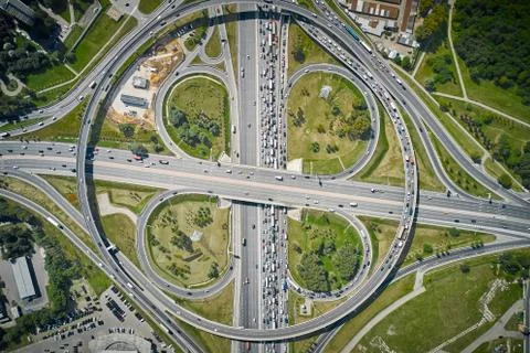 Huge metropolis intersection with clover exits, overpasses and highways. Stock Photos