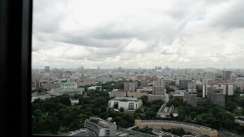 The huge metropolis is visible from the window of a tall building Stock Footage 136560742