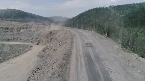 Huge mining truck is driving slow in Russia aerial video Видео 114832953