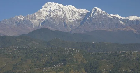 Huge mountain range rises to blue sky Stock Footage 70480209