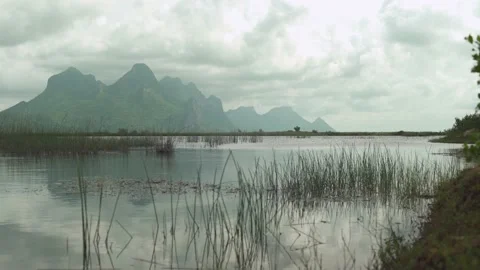 Huge mountain view landscape with a wide area of ​​water Stock Footage 221214816
