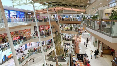 Huge multi-level trade mall with shops and walking people Stock Footage 129307731