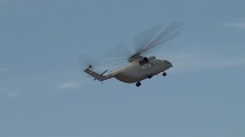 Huge multi-ton Mi-26 easily performs maneuvers in sky. Video stock 107132588