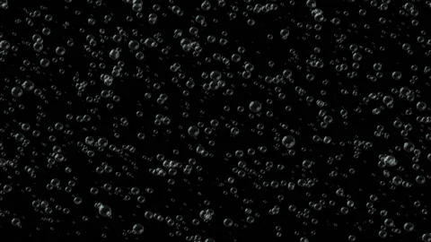 A huge number of bubbles rise up.Bubble Surges on Black Background Stock Footage 98608428