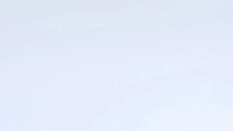 A huge number of pills falling on white background top view in slow motion. Stock Footage 72845799