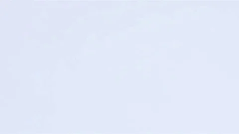 A huge number of pills falling on white background top view in slow motion. Stock Footage 72863826