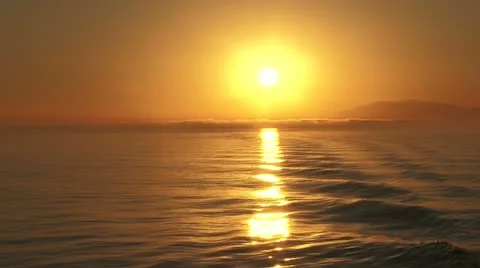Huge ocean sun glows bright in early evening Stock Footage 11194848