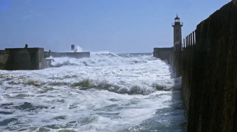 Huge ocean wave hitting lighthouse Stock Footage