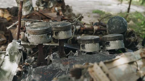 A huge old rusty airplane engine is lying in a landfill Stock Footage 197291476