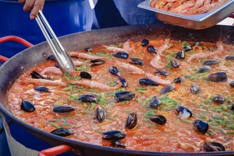 Huge pan with fresh seafood paella Stock Photos