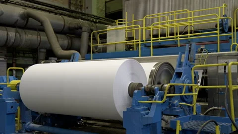 Huge paper material roll coiled by rotating drum in workshop Stock Footage 280906903