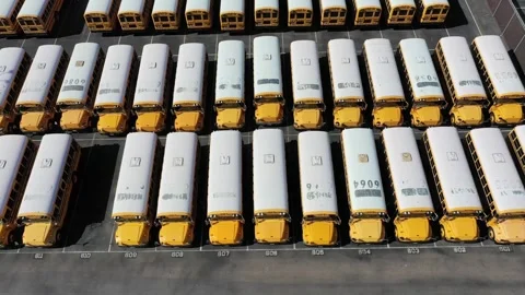 A huge parking lot of orange school buses in San Diego Stock Footage 256061978