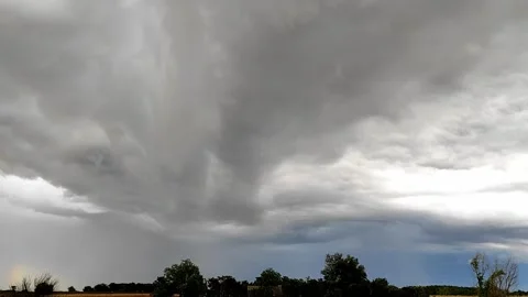 Huge passing supercell with rainbow Video Stock Footage 252532808