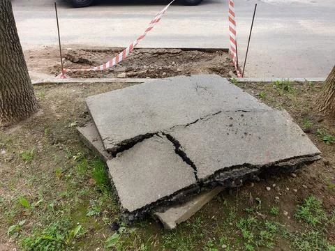 A huge piece of cut asphalt for patch repair of the road surface in the cou.. Stock Photos