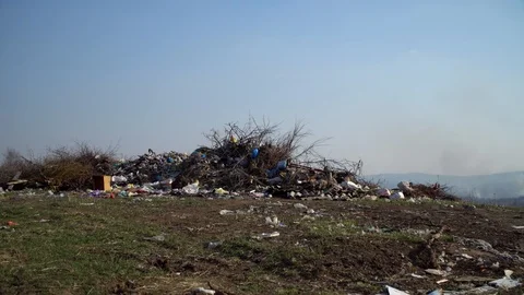 A huge pile of garbage in the middle of the field. Pollution in the environment Stock Footage 126659277