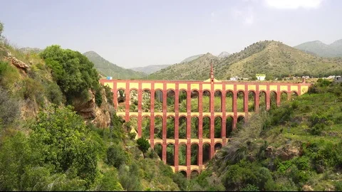Huge pink and yellow the Aguadilla Aqueduct in Nerja Spain Stock Footage