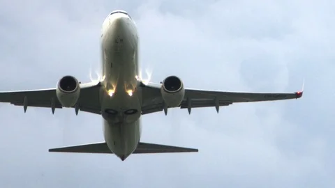 Huge plane flies overhead. Plane Take Off Stock Footage 77511548