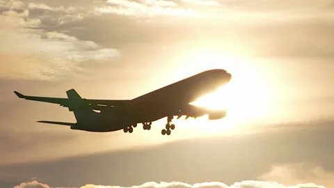Huge Plane Flying In Sunset Sky. Slow motion. Stock-Footage 91661686