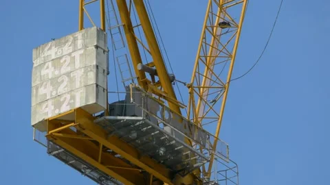 Huge Potain construction crane rotating something that it's lifting. Stock Footage 150108188
