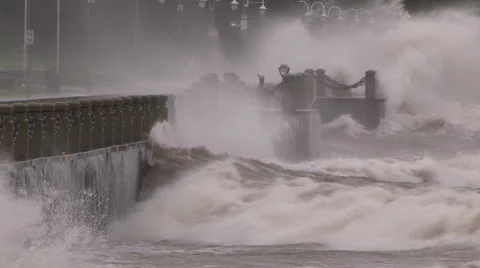 Huge powerful waves breaking at seawall in major severe storm Stock Footage 55452119