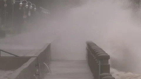 Huge powerful waves breaking at seawall in major severe storm Stock Footage 55452407