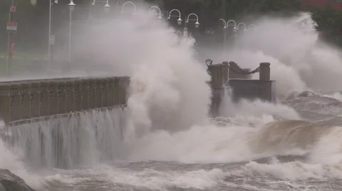 Huge powerful waves breaking at seawall in major severe storm Stock Footage 55452871