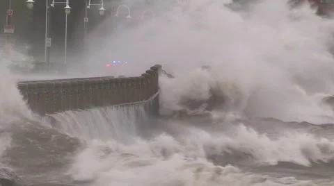 Huge powerful waves breaking at seawall in major severe storm Stock Footage 55452880