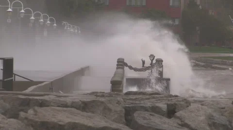 Huge powerful waves breaking at seawall in major severe storm Stock Footage 55453188