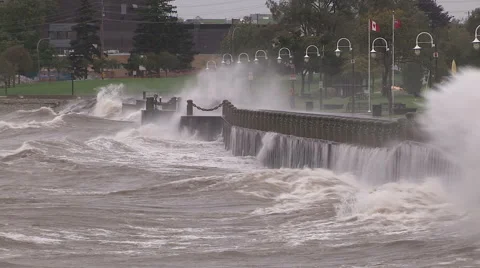 Huge powerful waves breaking at seawall in major severe storm Stock Footage 55453519