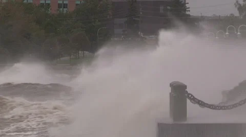 Huge powerful waves breaking at seawall in major severe storm Stock Footage 55453761
