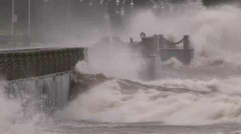Huge powerful waves breaking at seawall in major severe storm Stock Footage 67567336