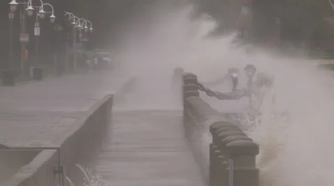 Huge powerful waves breaking at seawall in major severe storm Stock Footage 67569066