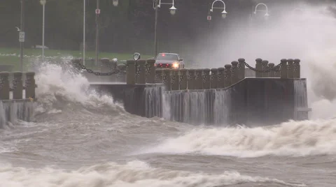 Huge powerful waves breaking at seawall in major severe storm Stock Footage 67570485