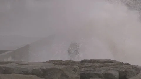 Huge powerful waves breaking at seawall in major severe storm Stock Footage 67572774