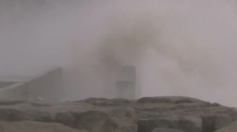 Huge powerful waves breaking at seawall in major severe storm Stock Footage 67572869