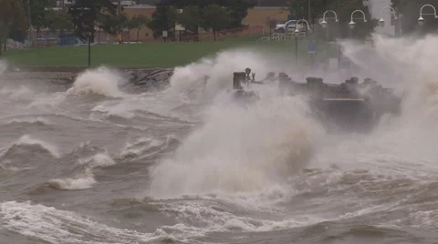 Huge powerful waves breaking at seawall in major severe storm Stock Footage 67576596
