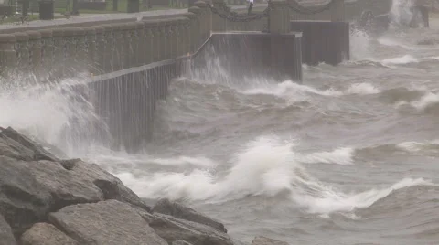 Huge powerful waves breaking at seawall in major severe storm Stock Footage 68958944