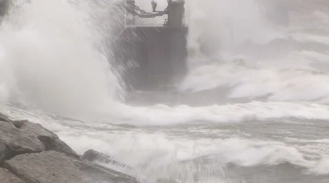 Huge powerful waves breaking at seawall in major severe storm Stock Footage 68959079