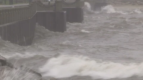 Huge powerful waves breaking at seawall in major severe storm Stock Footage 68959383