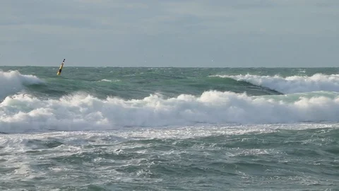 Huge powerful waves breaking at seawall in major severe storm. Stock Footage 99698642